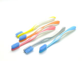 multicolored toothbrushes isolated on white background