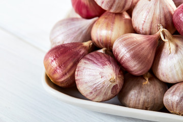 Fresh healthy garlic on white table