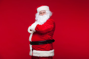 Santa Claus is dancing Isolated on red background.