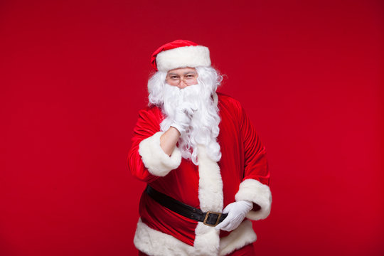 Santa Claus is dancing Isolated on red background.