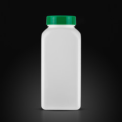 medicine white pill bottle isolated on a black background