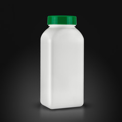medicine white pill bottle isolated on a black background
