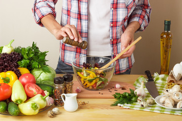 Woman cooks at the kitchen