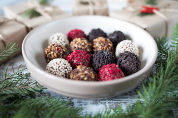 Homemade chocolate truffles on a christmas background