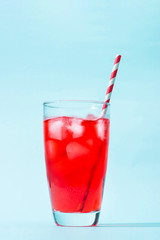 Sparkling red color drinks with water soda and ice in glass