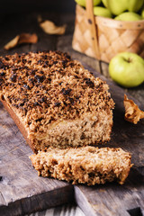 Homemade oatmeal apple cake crumbs on top on vintage rustic wooden background. Flourless, healthy dessert. Thanksgiving Day's treat dessert. Selective focus  