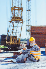 worker in protective wear at construction site