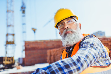 worker in protective wear at construction site