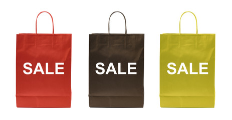Three paper bags with sale sign and different colors, red, black and yellow isolated on white background, including clipping path