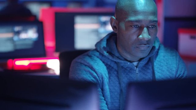  Close up computer hacker trying to gain access to a computer system