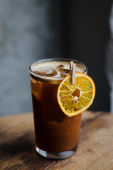 ICED COFFEE WITH ORANGE JUICE on a wooden table