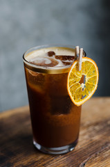 ICED COFFEE WITH ORANGE JUICE on a wooden table