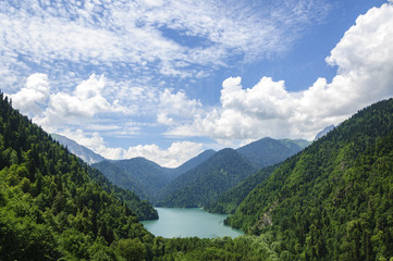Fototapeta na wymiar High-altitude lake Ritsa in Abkhazia in summer on a sunny, hot day.