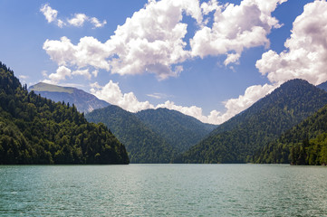 High-altitude lake Ritsa in Abkhazia in summer on a sunny, hot day.