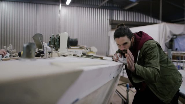  Father & son in boatyard building & renovating sailing boats, family business