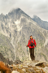 Hiking woman happy to be in the mountains