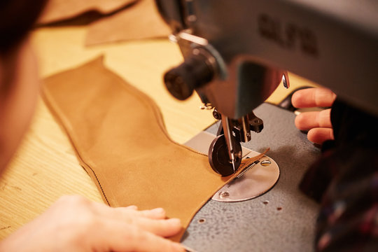 Shoemaker making leather shoes