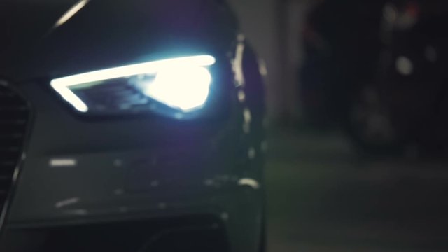 Car pulling up flashing headlights 