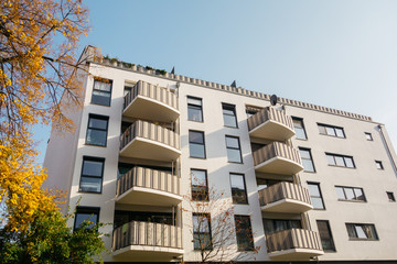 Obraz premium modern white apartment building with curved balcony