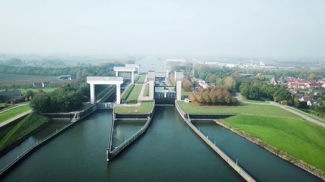 Aerial of a Boat entering the locks at the river Rhine in the Netherlands 