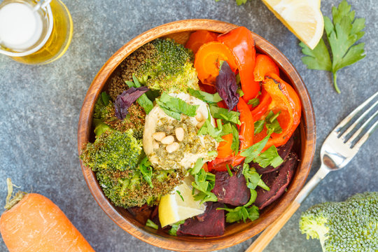 Vegetarian salad of baked vegetables with hummus