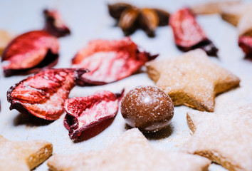 Festive background from cookies and dry leaves