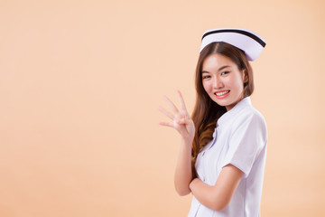 asian nurse pointing four fingers up