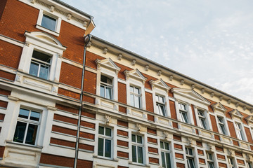 Fototapeta na wymiar red brick building with white stucco
