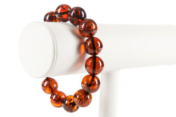 Amber jewelry on white background