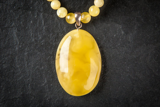 Amber Jewelry On Grey Background