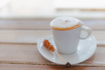 Close up white coffee cup on wood table