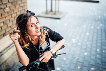 Funky smiling female on electric ride. Technology and hapiness concept