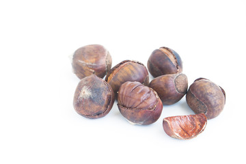 Roasted sweet chestnuts isolated on white background