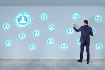 Businessman using social network interface on a wall 3D rendering