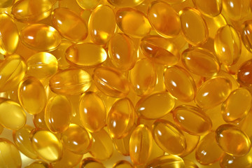 Omega-3 fish fat oil capsules as background