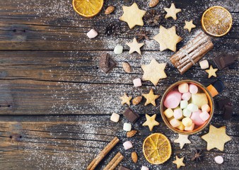 Christmas gingerbread cookies stars on a wooden table and coffe, selective focus