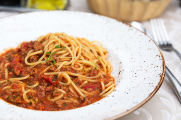 Spaghetti bolognese on a white plate