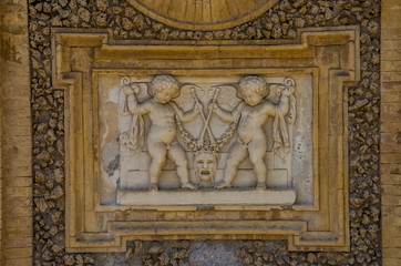 Obraz premium Ancient sculpture paintings on a fragment of the wall in the Villa Doria-Pamphili in Rome, Italy