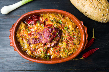 Dish of cabbage and meat in rustic bowl
