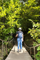 trekking and hiking , woman in wooden bridge over  river