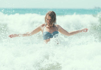 Happy woman having fun in the sea.