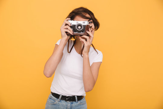Portrait of a young brunette girl making a photo