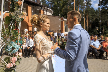 Young groom and beautiful bride. Outing wedding ceremony. Young family. Husband and wife.