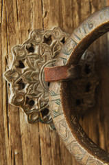 close-up antique old copper ring with an engraving on the door
