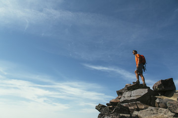 Male hiker standing on mountain summit