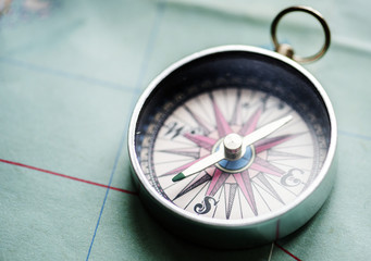 Closeup of compass on the map © Rawpixel.com