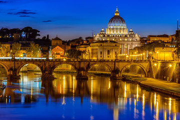 Fototapeta na wymiar Night view of Basilica St Peter, bridge Sant Angelo and river Tiber in Rome. Italy