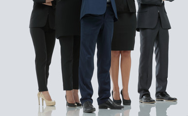 Team of successful and confident people posing on a white backgr