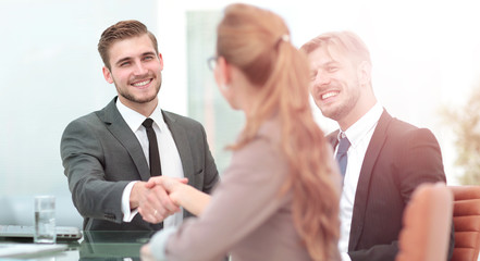 Fototapeta premium Business people shaking hands, finishing up a meeting