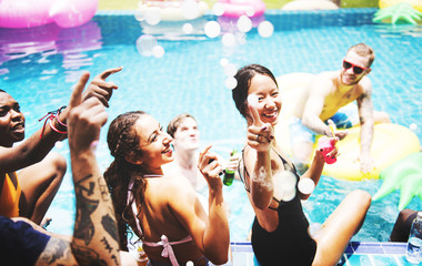 A diverse group of friends enjoying summer time by the pool